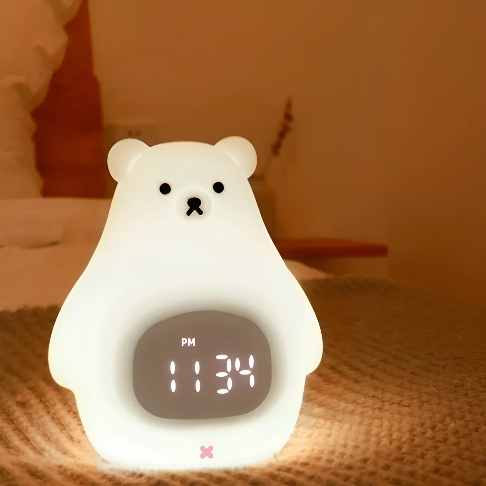 White silicone night light shaped as a cartoon bear with multi-colour LED illumination