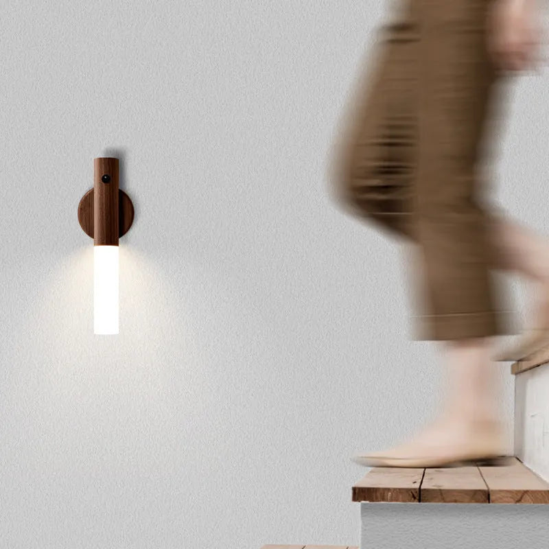 Compact wooden and acrylic motion sensor LED desk lamp on a desk