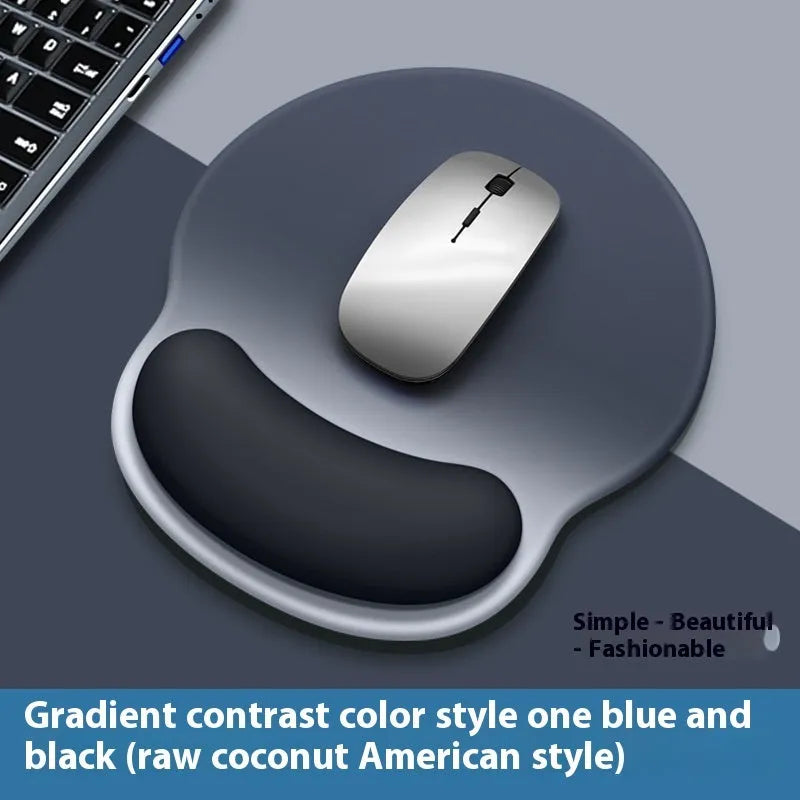 Silicone mouse mat with attached gel wrist support in a gradient blue colour on a desk.