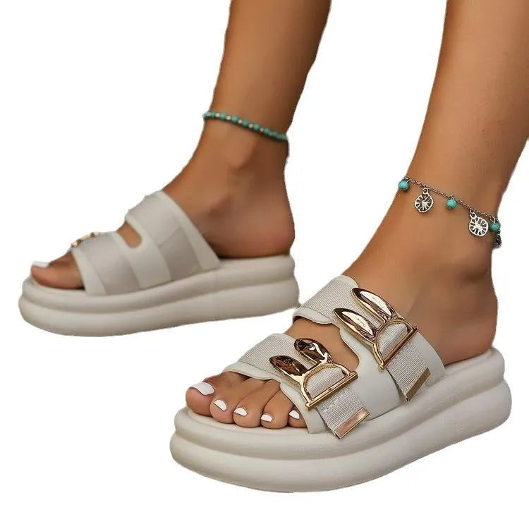 Women's apricot suede slippers with a thick rubber sole, shown on a white background.