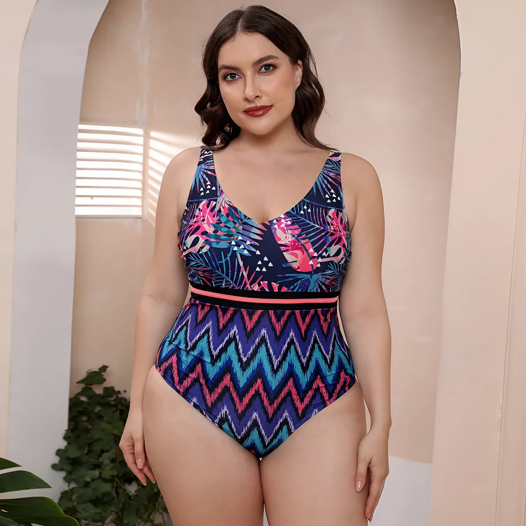 Blue and white printed one-piece swimsuit for women with spaghetti straps, shown on a mannequin.
