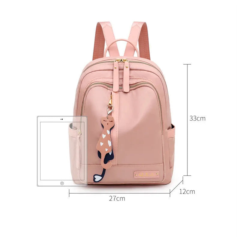 Women's black nylon casual backpack with waterproof construction and anti-theft compartments