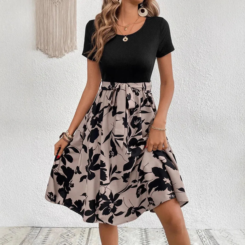 Women's khaki A-line dress with floral print and lace-up front detail.
