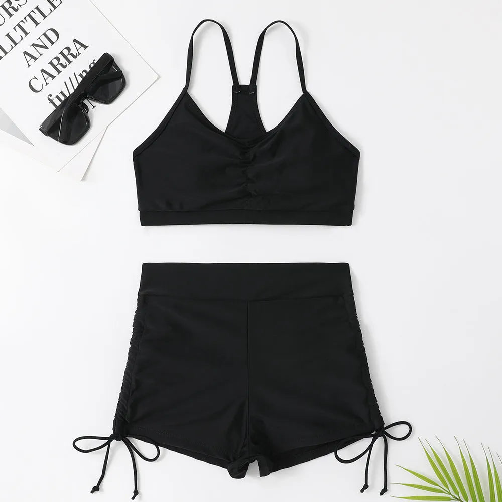 Women's high waist split swimsuit in black or purple colours with sleeveless design