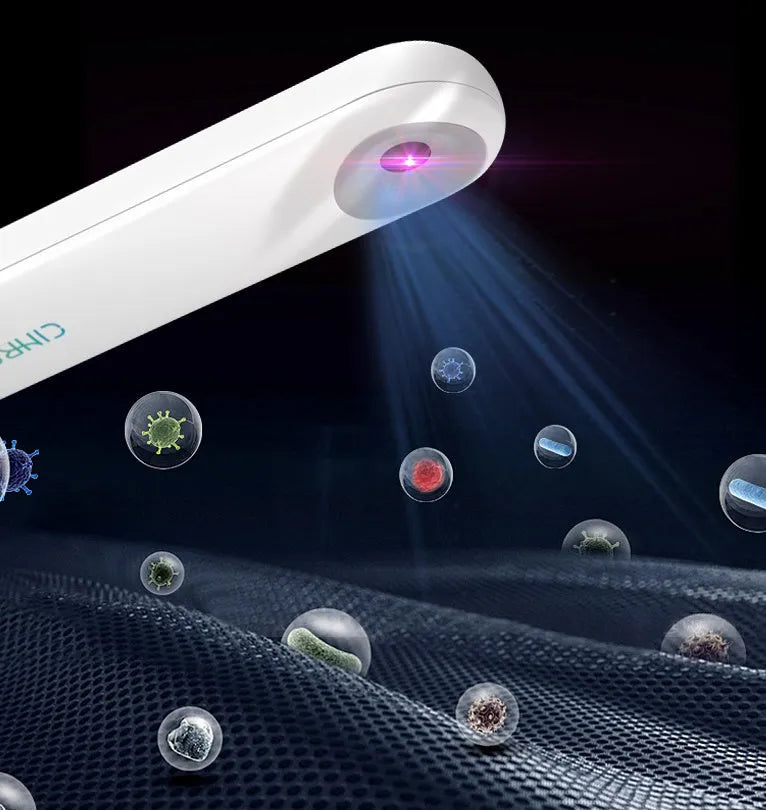 White portable UV sterilizer lamp for disinfecting mobile phones and small items.