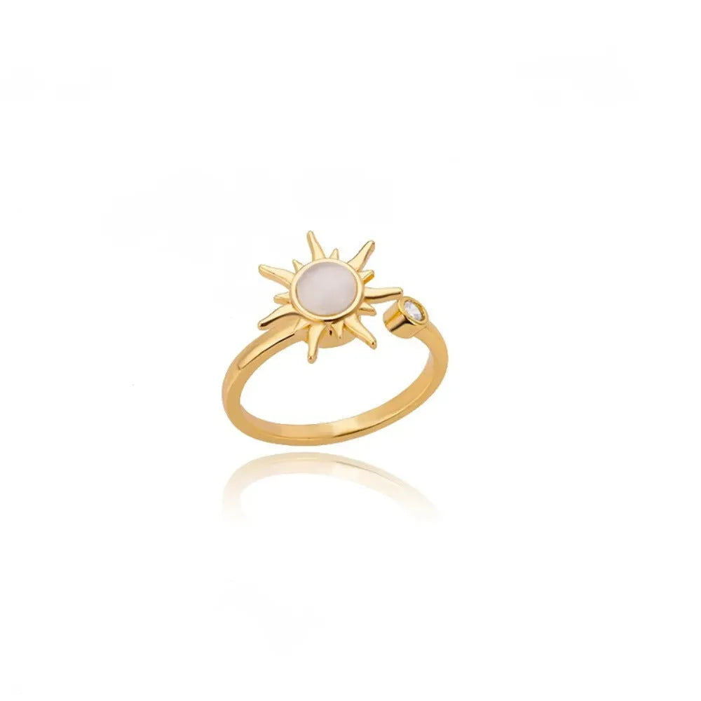 Adjustable copper ring with rotatable element in gold or platinum finish, simple geometric design