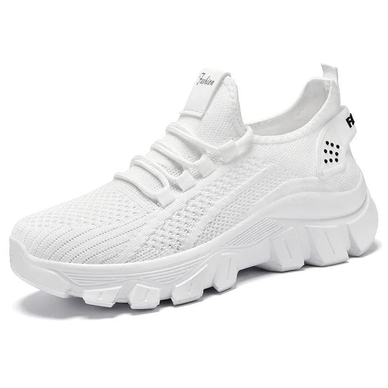Men's white Flyknit lace-up running sneakers with a thick PVC sole on a plain background.