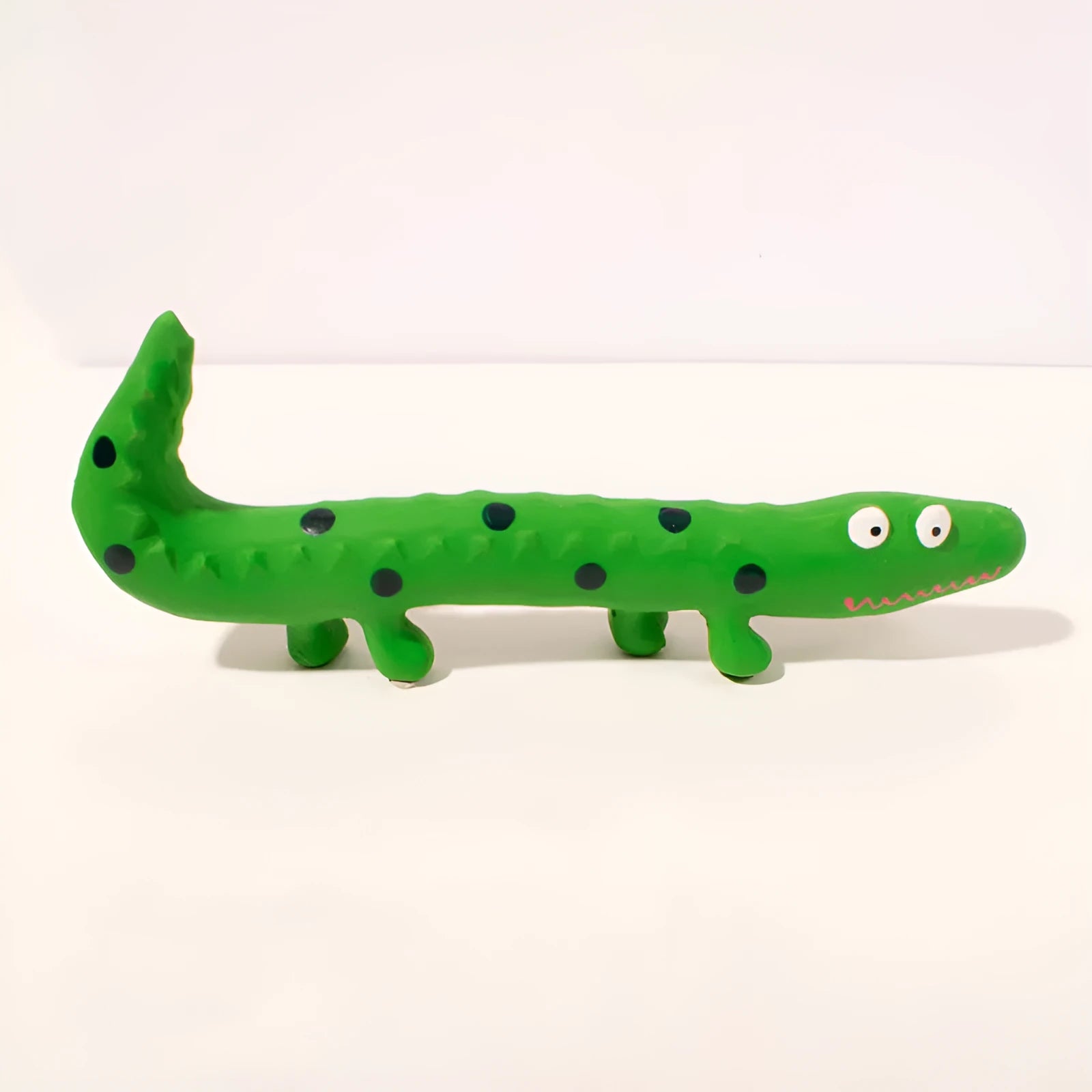 Green lizard-shaped squeaky dog chew toy for aggressive chewers.