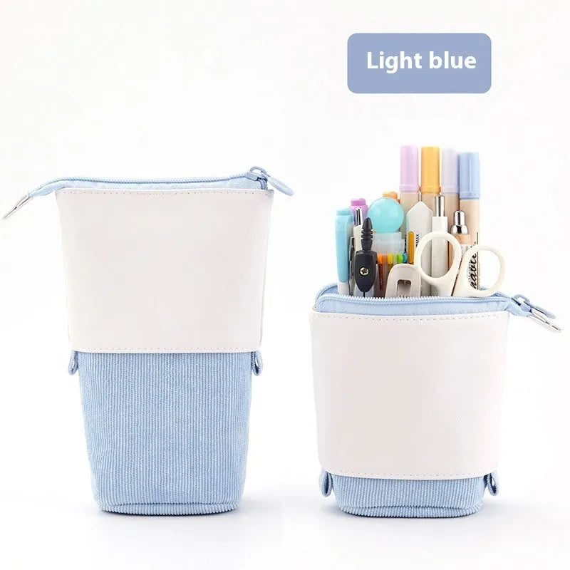 Corduroy drop-down telescopic stationery case in six colour options on a desk
