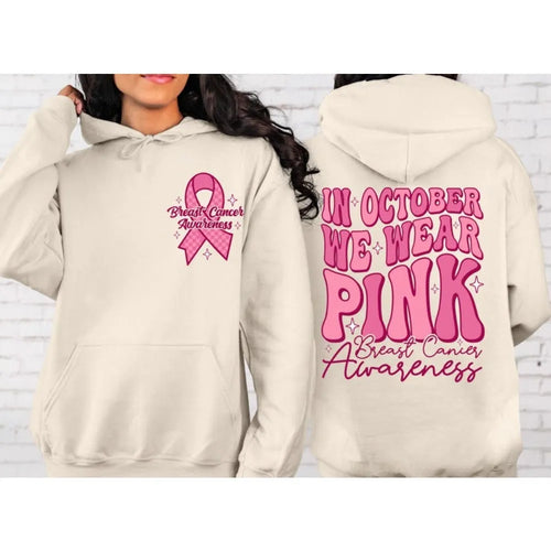 Breast Cancer Awareness pullover hoodie with retro art print and side seam pockets, shown in pink.