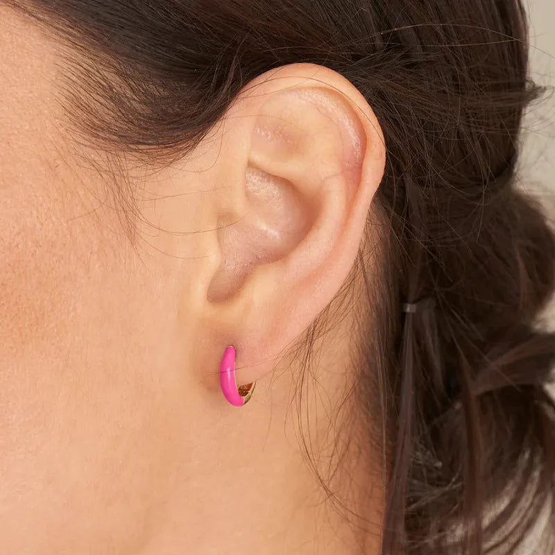 Geometric U-shaped oval epoxy earrings in dripped oil colours on copper wire.