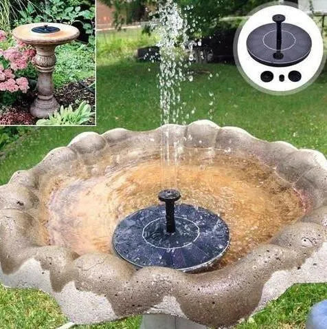 Black solar-powered floating fountain pump with four spray nozzles on a solar panel for garden ponds