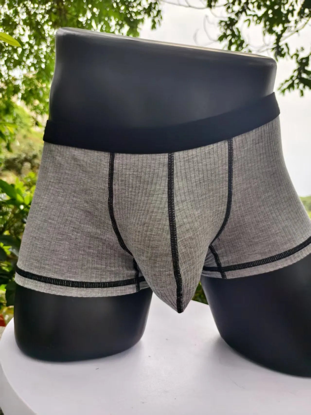 Men's solid colour breathable boxers in army green, shown flat.