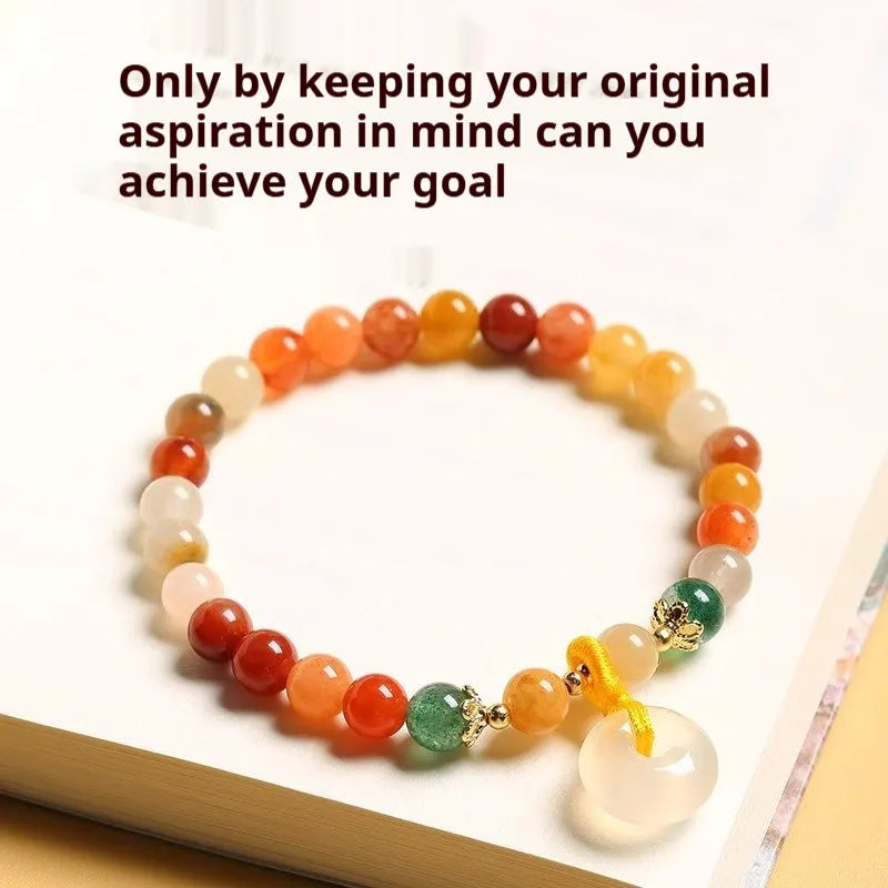 Natural jinsi jade bracelet with peace clasp showing agate and strawberry quartz beads