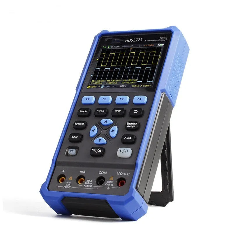 Handheld digital oscilloscope with probe on workbench for automotive electrical testing