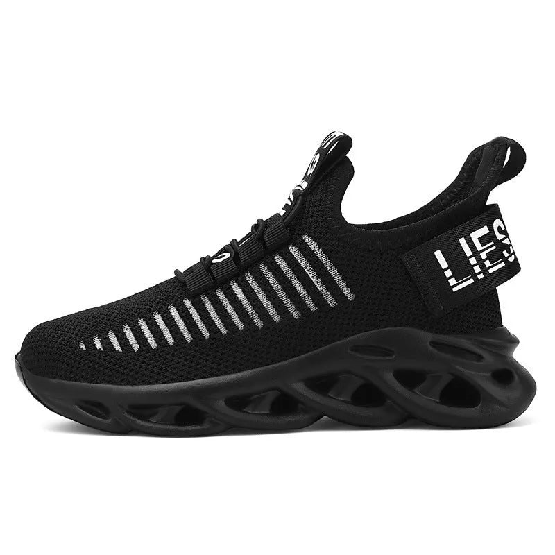 Kids black coconut sneakers with Velcro strap and fabric upper on a non-slip EVA sole.