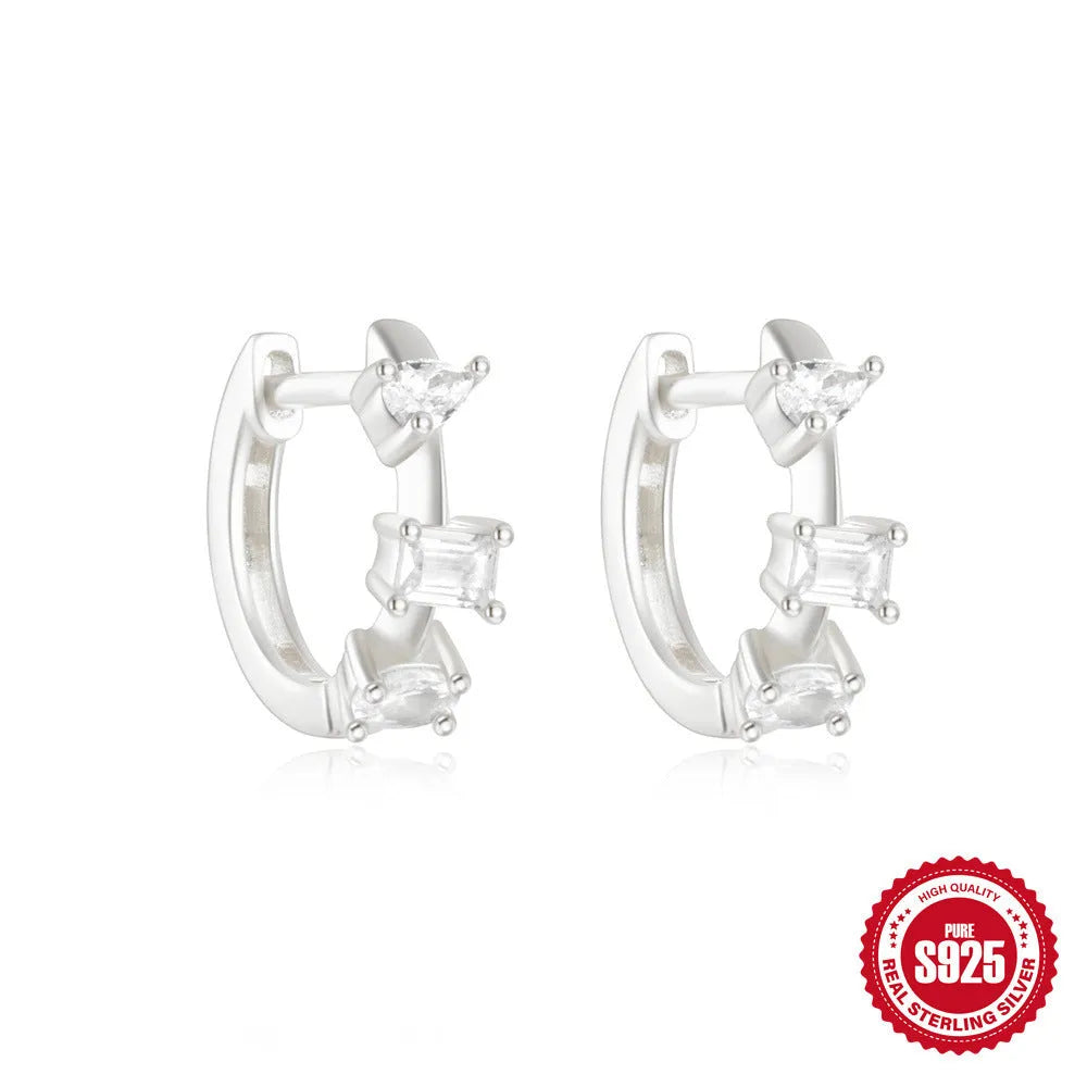 Sterling silver geometric stud earrings with small round designs in gold or silver electroplated finishes