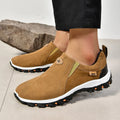 Men's grey slip-on shoe cover with round toe and rubber sole on a white background.