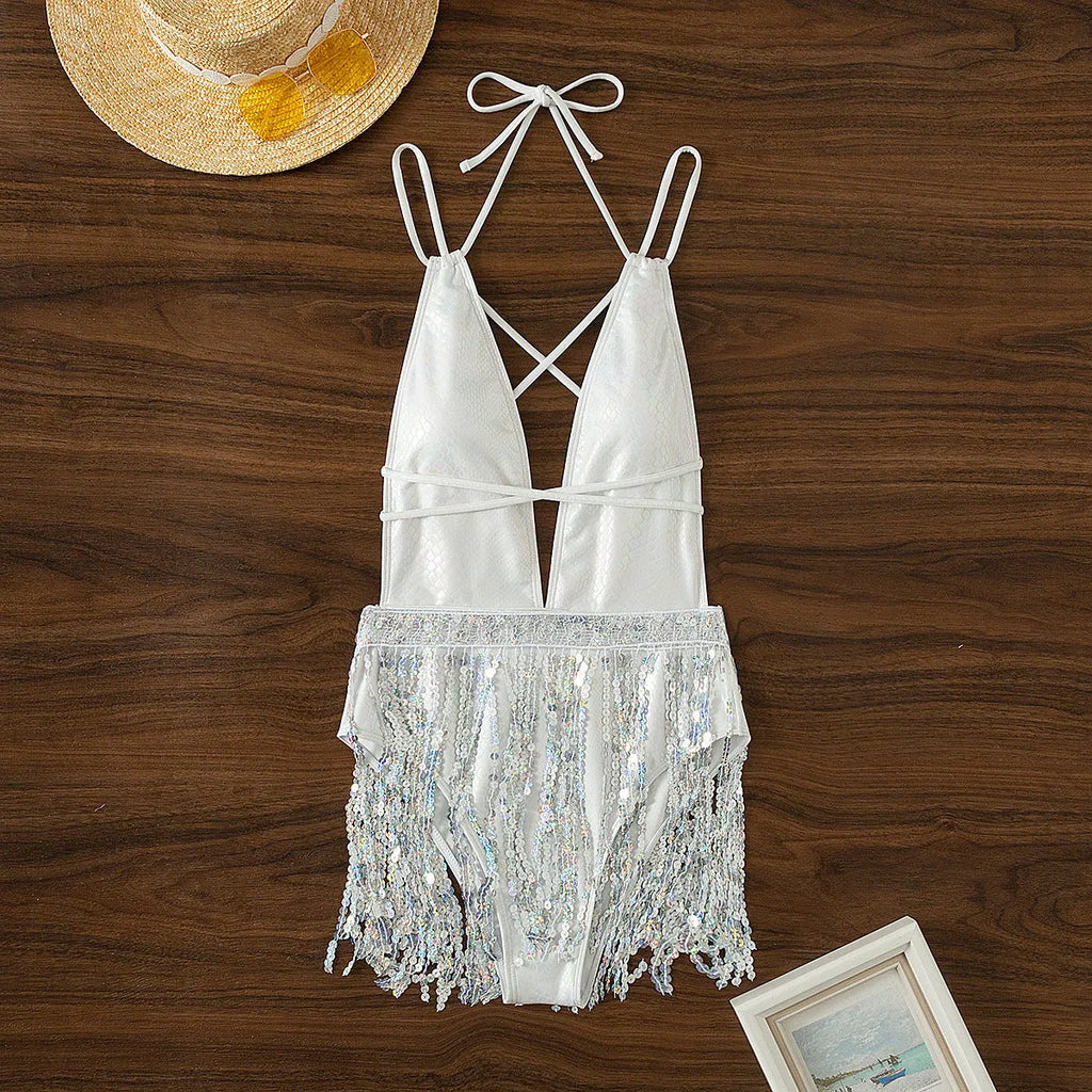 White deep V neck one-piece swimsuit with tassel detailing on woman