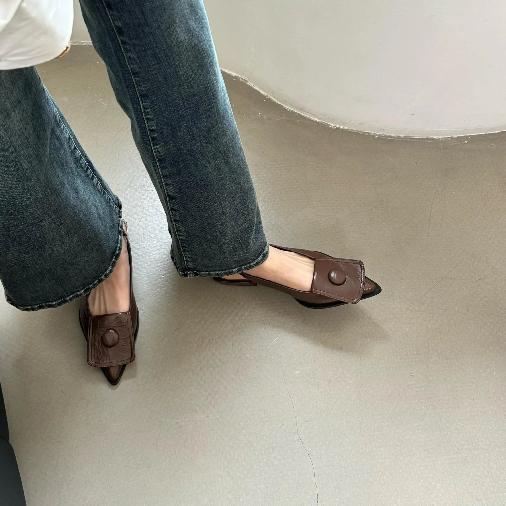Women's pointed toe low heel sandals with back strap in apricot colour.