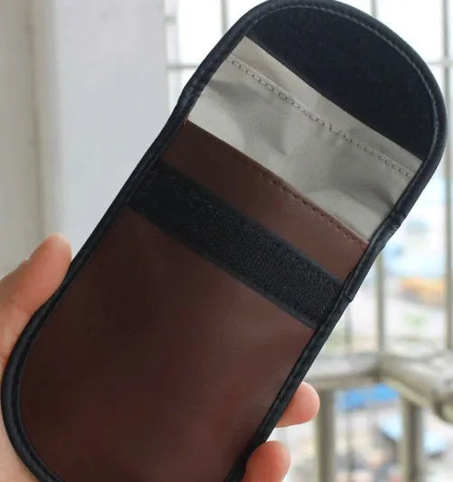 Black microfiber RFID blocking bag for mobile phones and credit cards, measuring 13.5 by 9.5 cm.