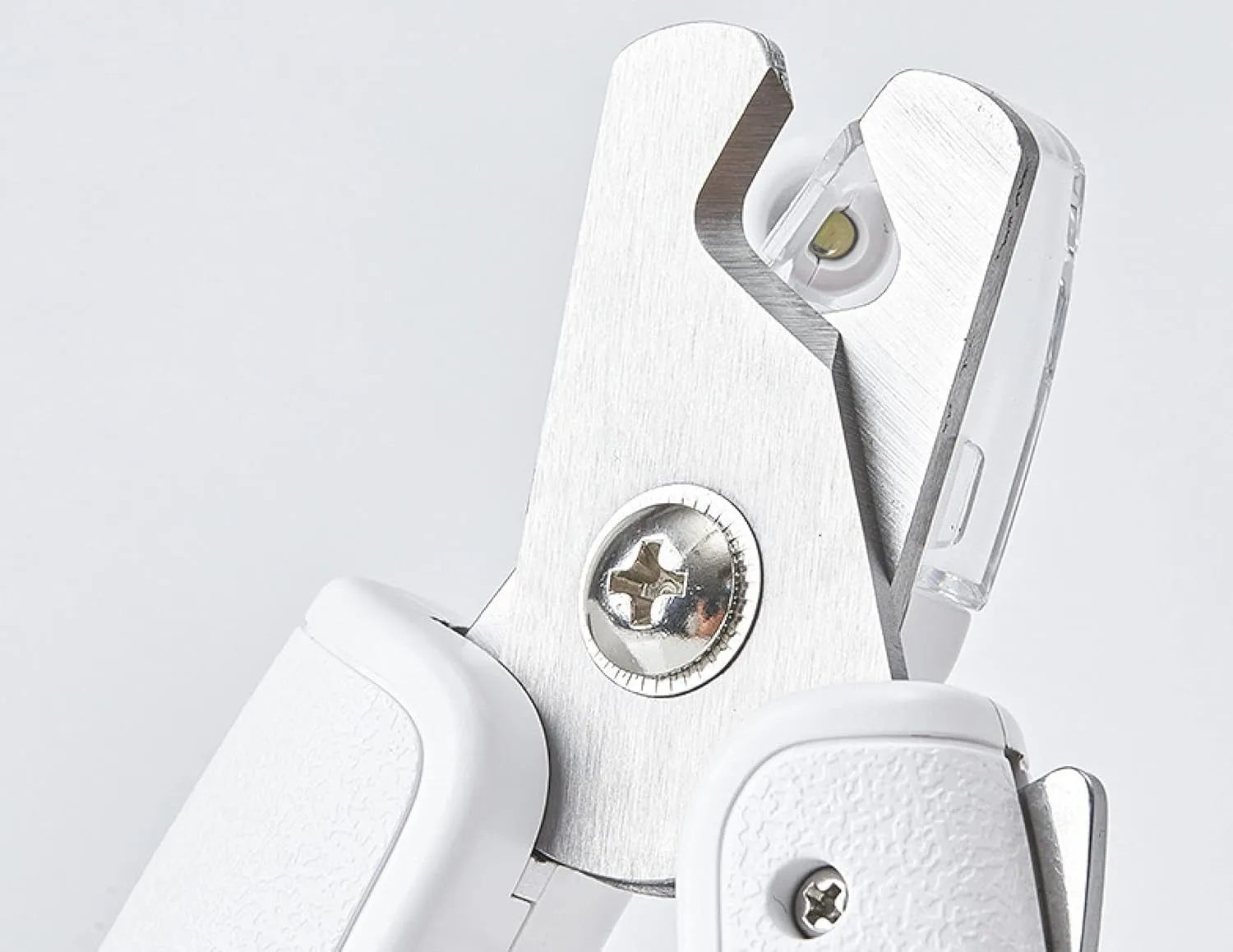 White LED pet nail clippers with open anti-splash guard and nail file on a solid colour background