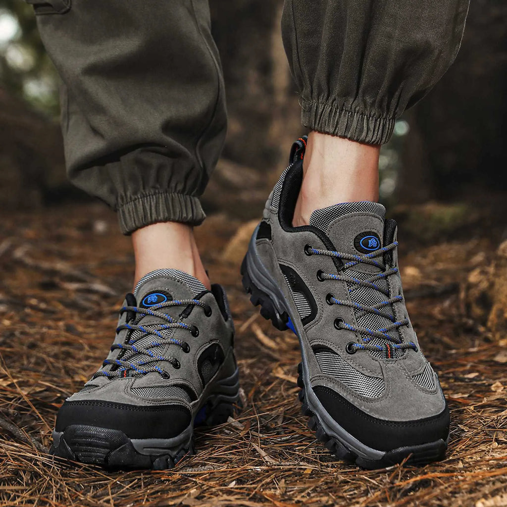 Men's waterproof non-slip mountain climbing sneakers soft bottom in army green on rocky trail