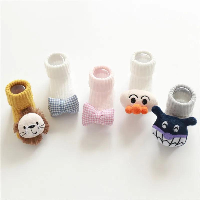Cotton baby floor socks in various patterns including animal prints, stars, and bows for infants aged 0-3 months