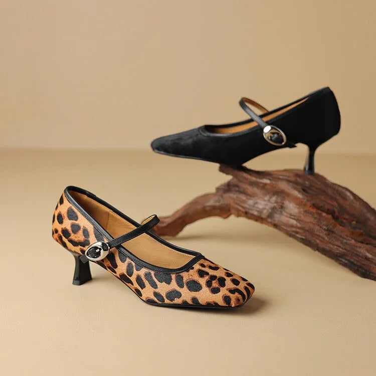 Women's black square toe stiletto ankle-strap high heel shoe made from horse hair.