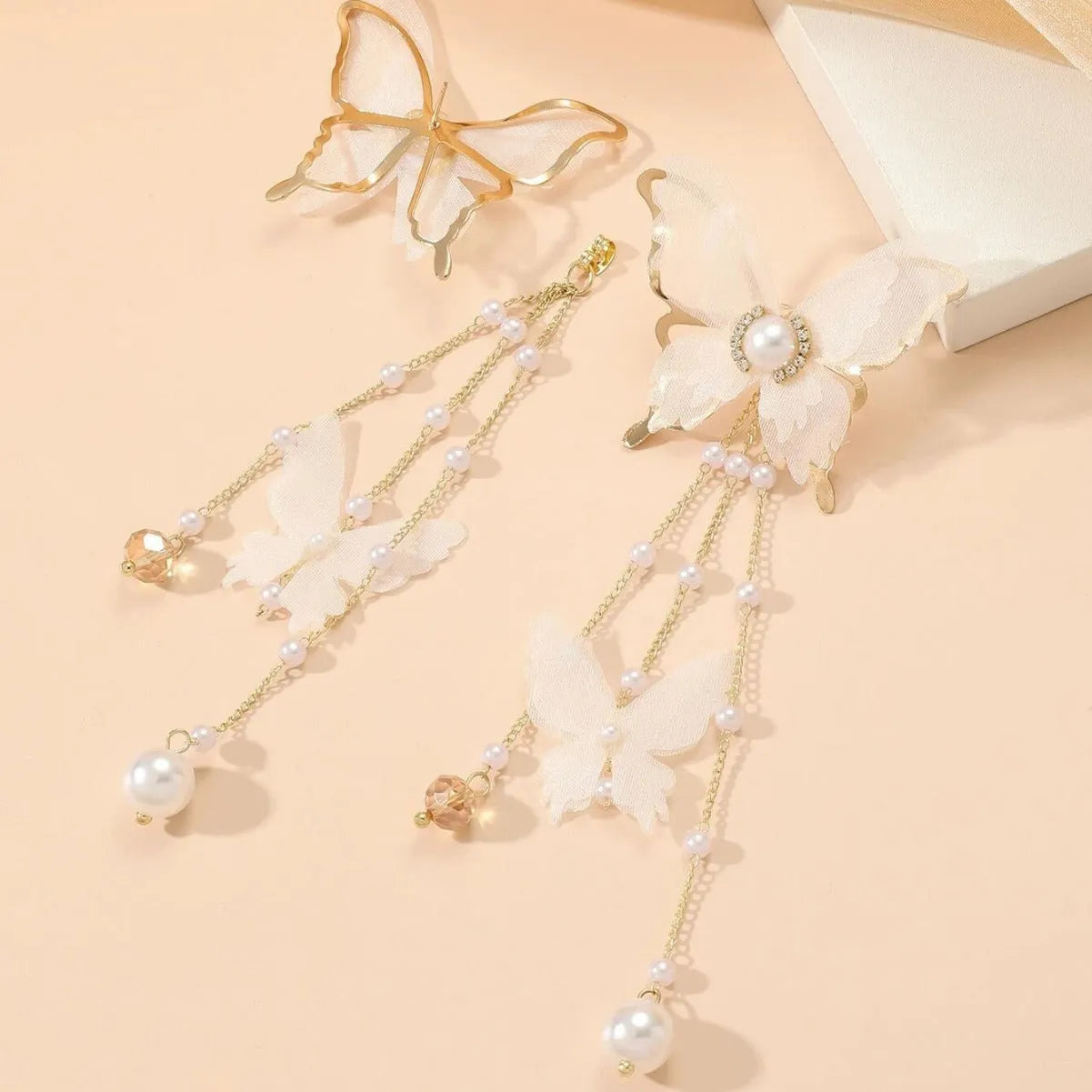 White butterfly earrings with tassel lace, pearl and rhinestone decorations on copper alloy