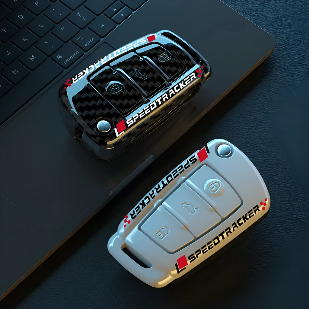 Carbon fibre style car key cover with mirror in feilin material, shown in carbon colour.
