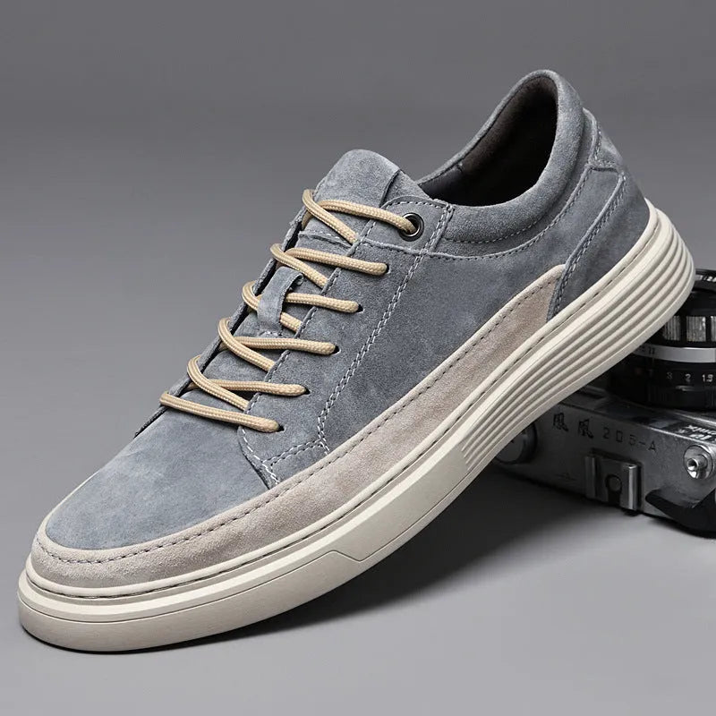 Men's grey casual skate shoes with pigskin upper and rubber sole on a white background