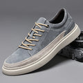 Men's grey casual skate shoes with pigskin upper and rubber sole on a white background