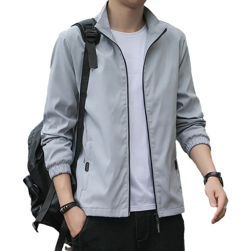 Korean style loose fit thin autumn jacket in blue with lapel collar and zip pockets.