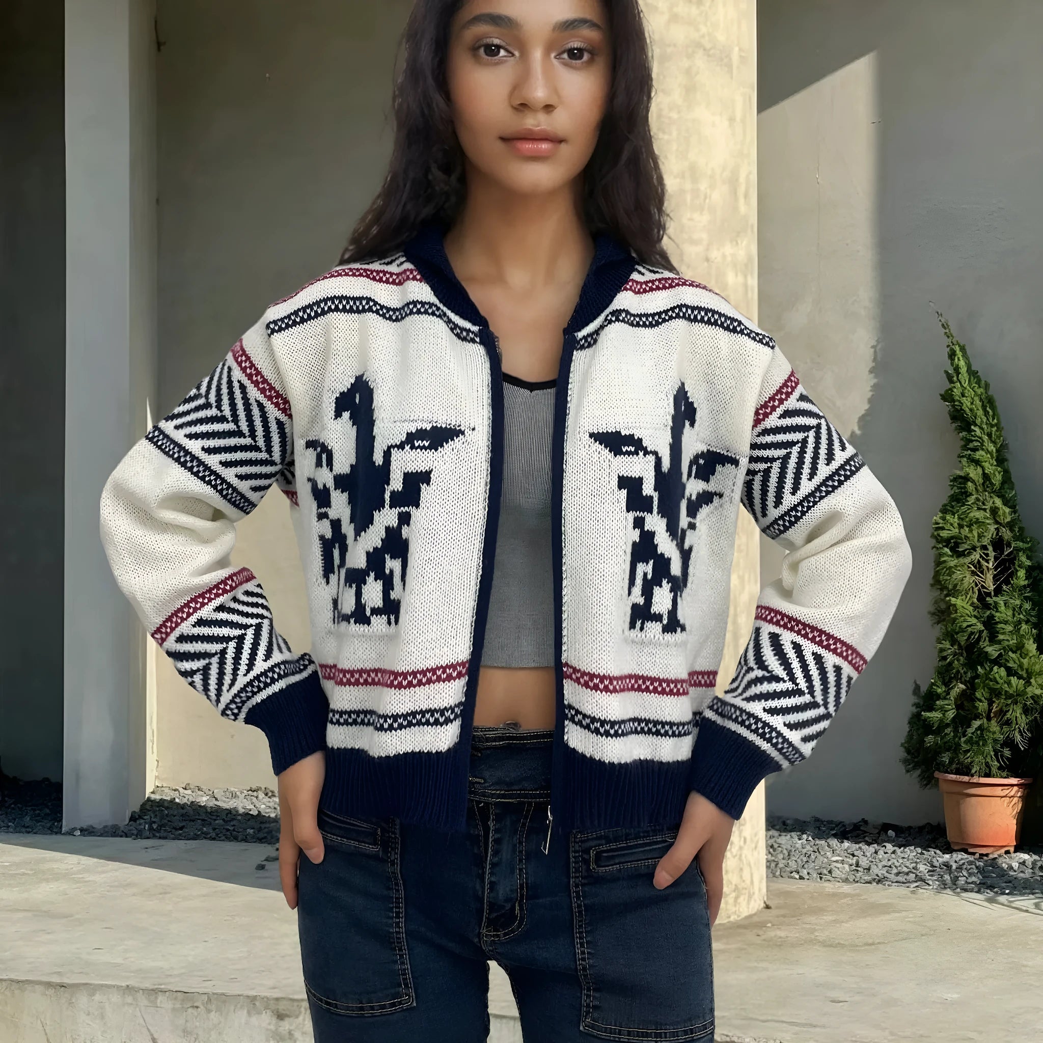 White women's zip-front cardigan with lapel collar and contrast-colour jacquard stripe pattern.
