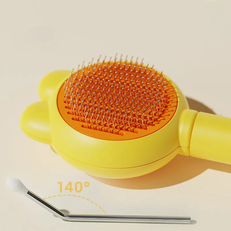Self-cleaning pet grooming brush with release button in green, pink, purple or yellow colours