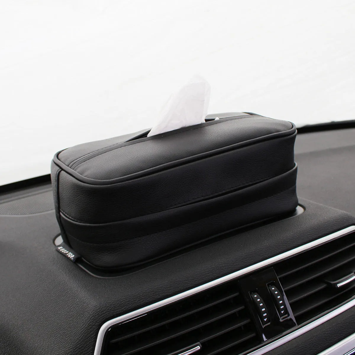 Black PU leather car hanging storage organiser bag shown with documents inside