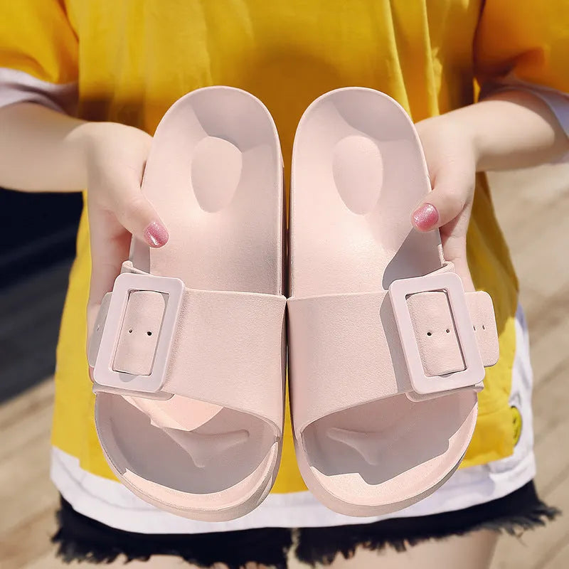 Women's grey blue flip flop slippers with a buckle strap and soft EVA sole.
