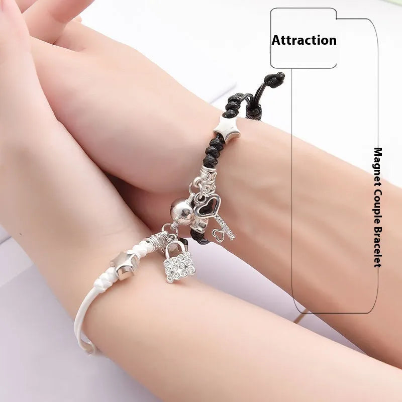 Pair of alloy suction bracelets with engraved symbol choices including crown, love lock, and clover.