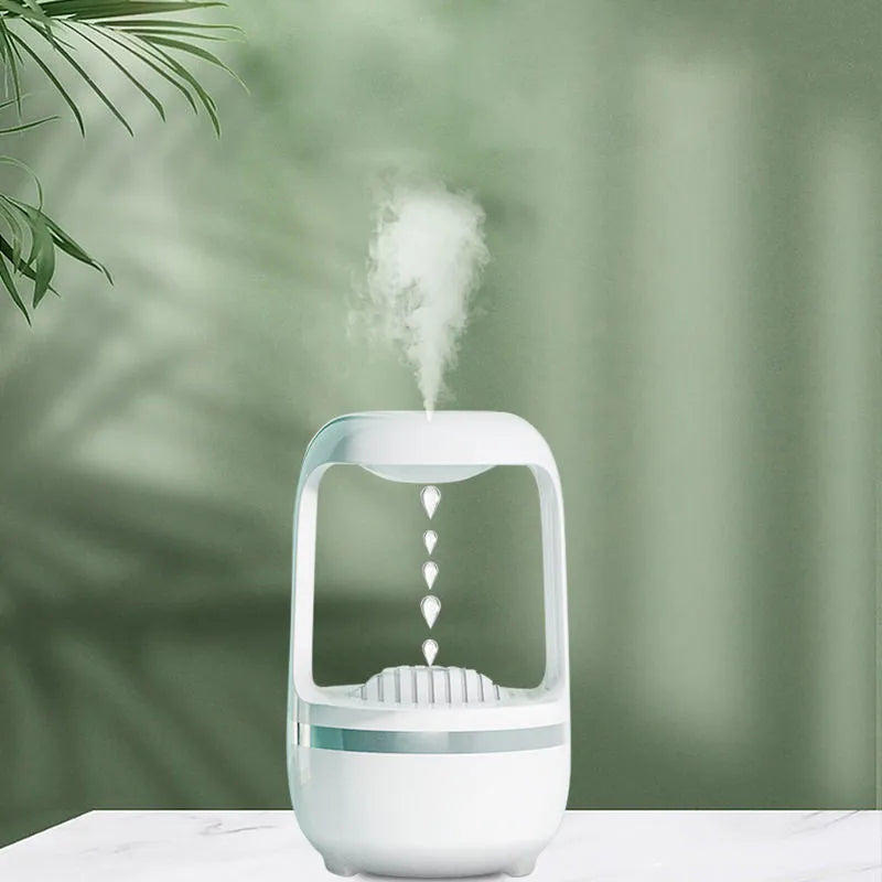 Black anti-gravity humidifier showing water droplet backflow effect with USB cable