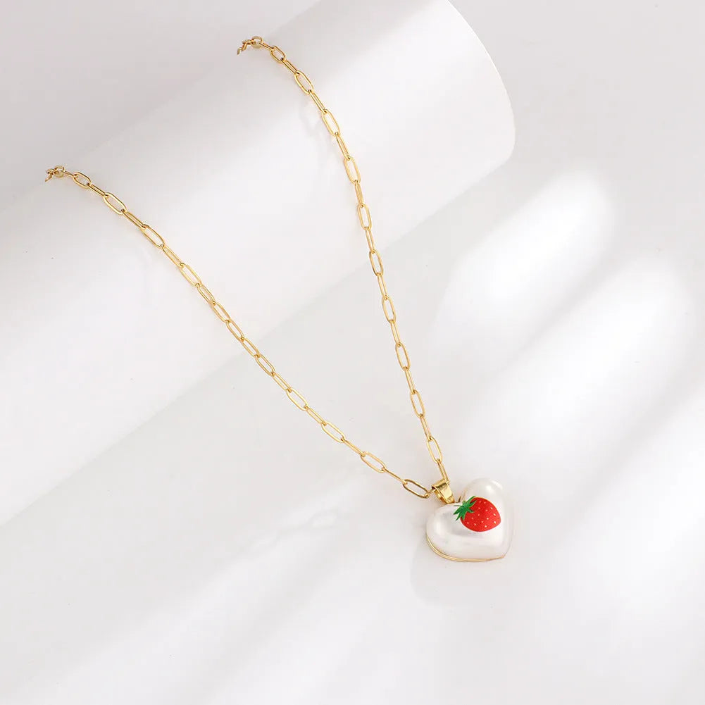 Heart-shaped necklace with a choice of fruit pendant charms on an adjustable chain.