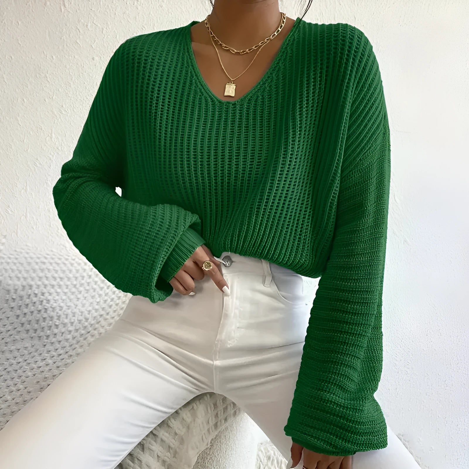Women's solid colour long sleeve pullover top in polyester, shown in available colours.