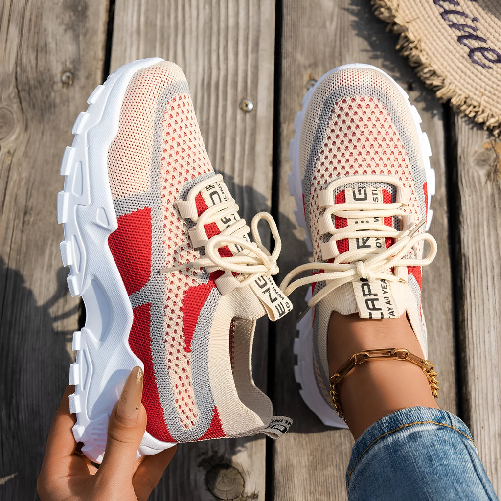 Women's Flyknit lace-up sneakers in a selected colour with a low rubber sole and round toe