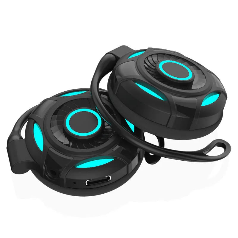 Black Bluetooth earphones with hanging ear design and USB charging cable