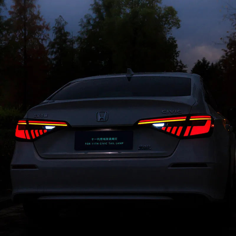 11th Generation Honda Civic black and red LED tail light assembly with sequential turn signal streamer.
