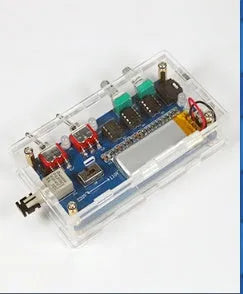Arc extinguishing SSTC Tesla coil driver board with controller and connection cables on a dark surface.