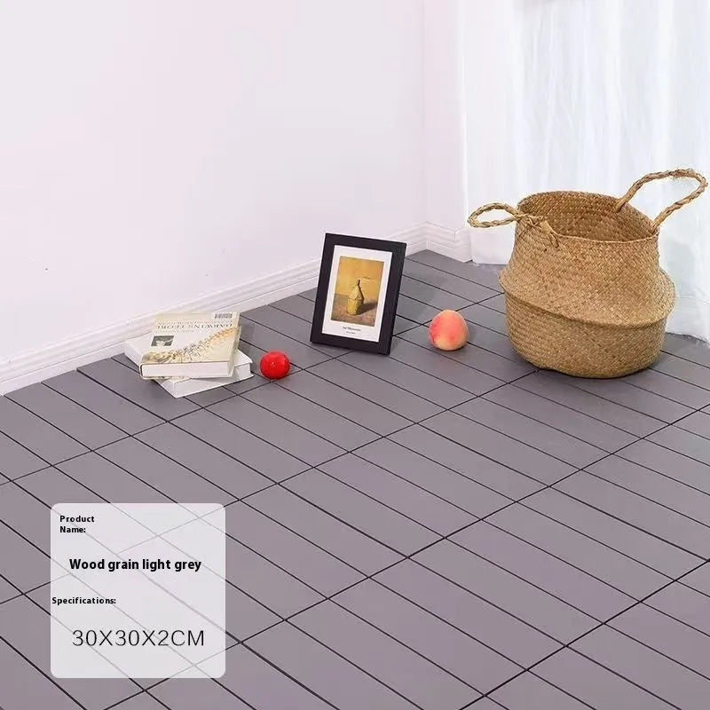 Pack of ten wood grain plastic floor tiles showing splicing edges and non-slip texture