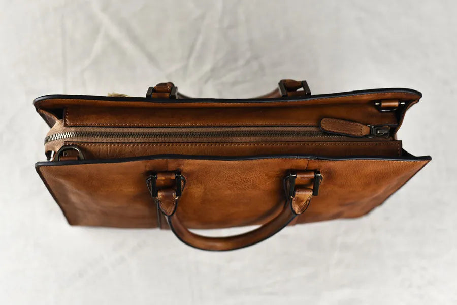 Men's 14 inch horizontal leather handbag in vegetable tanned cowhide with zipper closure