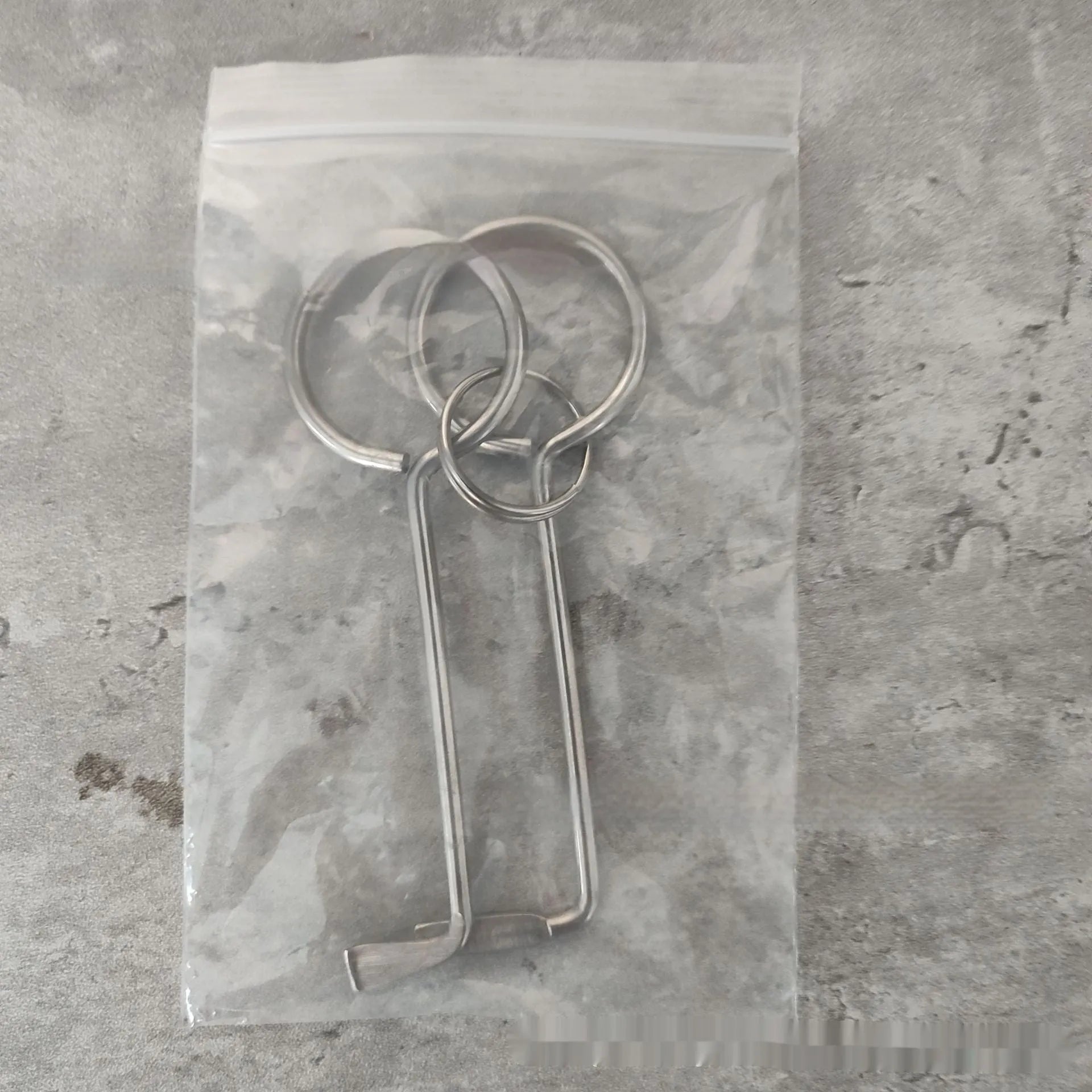 Two-piece alloy metal wrench tool set for portable household DIY use.