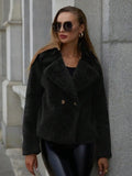 Loose short women's coat in rose red faux fur with regular sleeves on a hanger.